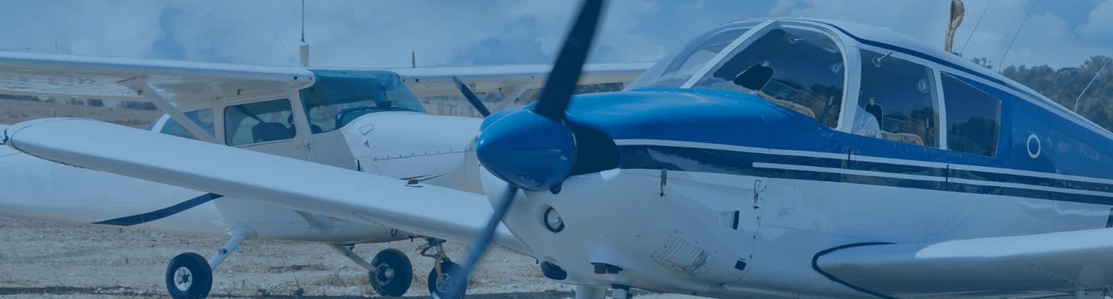 Small aircraft on a runway at McDougall Energy aviation fuel station.