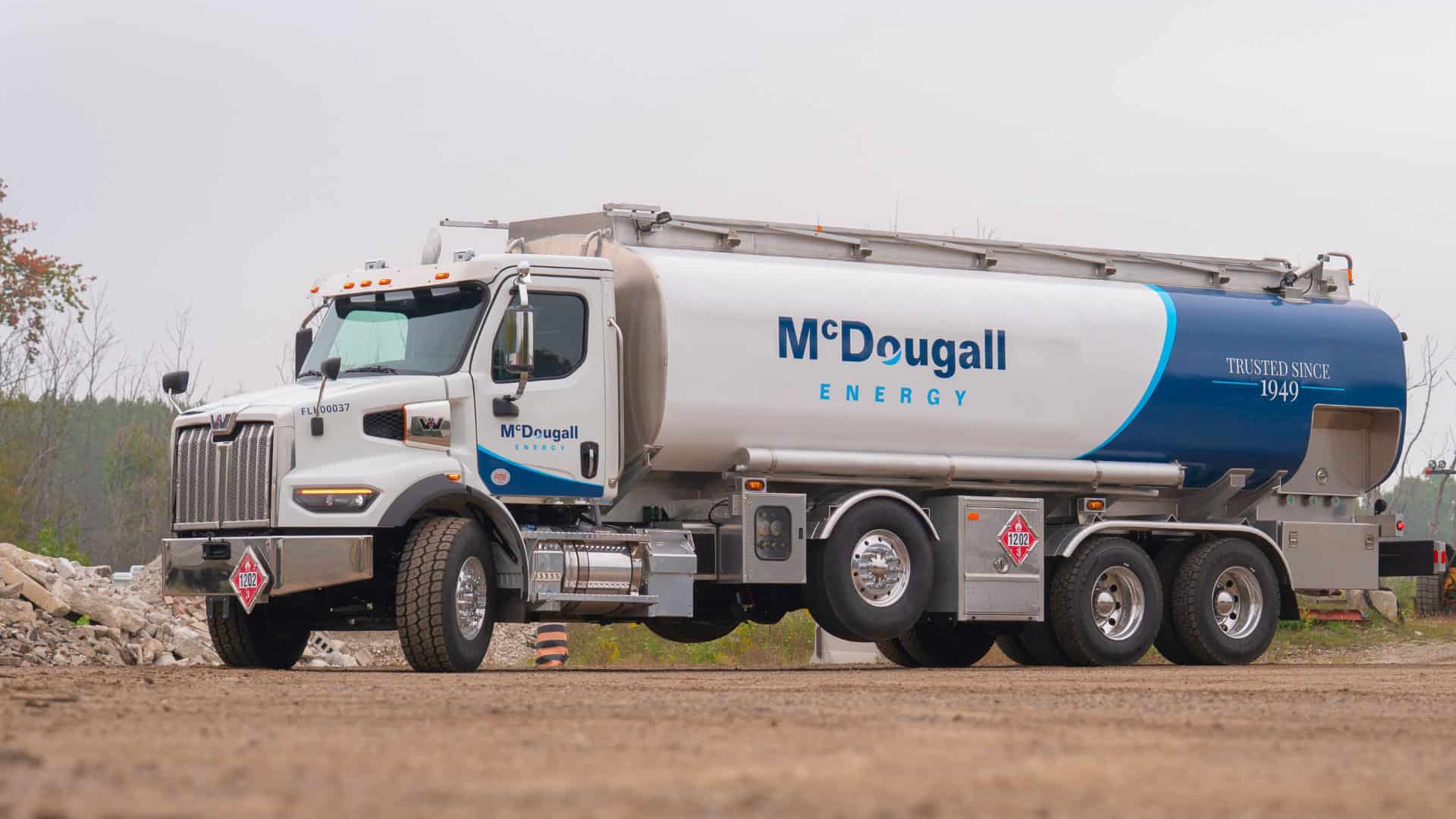 McDougall Energy fuel tanker truck delivering home heating oil on-site in Ontario.