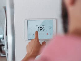 Smart home thermostat controlling heating system for energy efficiency.