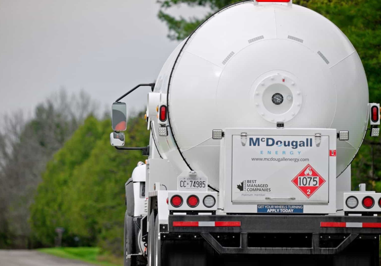Propane truck delivery free fuel referral program reward to McDougall Energy customer.
